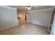 Open-concept living room features tiled flooring, recessed lighting, and seamless flow into the kitchen area at 3433 Soho St # 101, Orlando, FL 32835