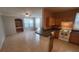 Open floorplan shows living room with large windows, a built-in desk, and open kitchen at 3433 Soho St # 101, Orlando, FL 32835