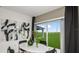 Open dining area with backyard views, contemporary decor, and a modern oval table at 404 Wayland Dr, Haines City, FL 33844