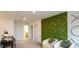 Stylish living room with decorative green accent wall, modern furniture, and chic decor at 404 Wayland Dr, Haines City, FL 33844