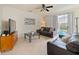 Inviting living area with tile floors, a ceiling fan, and sliding glass doors leading to the outdoor area at 405 Carriage Way Ct, Oviedo, FL 32765