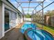 A screened-in pool with an attached spa is perfect for outdoor relaxation and entertainment at 405 Carriage Way Ct, Oviedo, FL 32765
