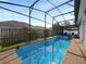A sparkling screened-in pool area provides an inviting space for outdoor enjoyment and relaxation at 405 Carriage Way Ct, Oviedo, FL 32765