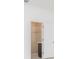Bathroom featuring a tiled shower with glass door and dark cabinets at 4176 Sagefield Dr, Harmony, FL 34773