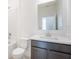 Well-lit bathroom with a bathtub, white subway tile, a dark vanity, and a quartz countertop at 4176 Sagefield Dr, Harmony, FL 34773