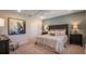 Spacious bedroom with soft lighting, neutral tones, and a stylish accent wall at 4176 Sagefield Dr, Harmony, FL 34773