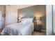 Cozy bedroom with large windows, comfortable bed, and neutral color scheme at 4176 Sagefield Dr, Harmony, FL 34773