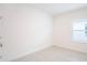 Bright, empty bedroom with tile flooring, a window, and neutral walls at 4176 Sagefield Dr, Harmony, FL 34773