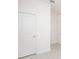 Hallway with a view to two doors and light colored tile at 4176 Sagefield Dr, Harmony, FL 34773