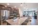 Beautiful kitchen with granite countertops, stainless steel appliances, and modern pendant lighting at 4176 Sagefield Dr, Harmony, FL 34773