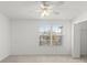 Bright bedroom with a ceiling fan, closet and a window for natural light at 435 Tradition Ln, Winter Springs, FL 32708
