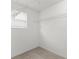 Walk-in closet with a window and wire shelving for efficient storage at 435 Tradition Ln, Winter Springs, FL 32708