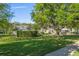 Neighborhood park featuring green space, a playground, landscaping and community buildings at 435 Tradition Ln, Winter Springs, FL 32708