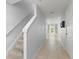 Bright hallway features tile flooring, stairway to the second floor and access to the living area at 435 Tradition Ln, Winter Springs, FL 32708