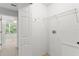 Functional laundry area featuring hookups, shelving and storage solutions at 435 Tradition Ln, Winter Springs, FL 32708