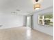 Open-concept living space includes the kitchen with stainless steel appliances, a dining area, and views of backyard at 435 Tradition Ln, Winter Springs, FL 32708