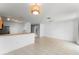 Open-concept living space includes the kitchen with stainless steel appliances, a dining area, and views of backyard at 435 Tradition Ln, Winter Springs, FL 32708