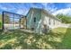Spacious backyard with mature trees and screened in patio and pool at 4536 Barrister Dr, Clermont, FL 34711