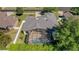 Aerial view of the backyard with a screened-in pool and fenced yard at 4536 Barrister Dr, Clermont, FL 34711