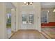 Grand entryway featuring tiled floors, chandelier, and decorative glass doors at 4536 Barrister Dr, Clermont, FL 34711