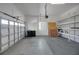 Spacious garage with ample storage shelving and a functional garage door at 4536 Barrister Dr, Clermont, FL 34711