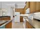 Well-equipped kitchen featuring ample cabinet space and modern appliances, leading to other living areas at 4536 Barrister Dr, Clermont, FL 34711