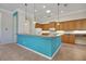 Kitchen featuring a breakfast bar, pendant lighting, and ample wood cabinetry for storage at 4536 Barrister Dr, Clermont, FL 34711