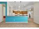 Open kitchen with a breakfast bar offering pendant lighting and a view of the appliances at 4536 Barrister Dr, Clermont, FL 34711