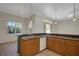 Bright kitchen featuring tile floors, breakfast bar, pendant lighting, and stainless steel dishwasher at 4536 Barrister Dr, Clermont, FL 34711