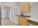 Bright laundry area with stackable washer/dryer and convenient sink and storage at 4536 Barrister Dr, Clermont, FL 34711