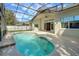 Inviting screened-in pool with covered patio and outdoor ceiling fan at 4536 Barrister Dr, Clermont, FL 34711