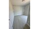 Simple bedroom with light gray walls, wood-look floors and a large window, creating a bright atmosphere at 4537 Conley St, Orlando, FL 32811