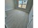 Cozy bedroom with hardwood floors, a window view, and neutral walls, creating a serene and relaxing space at 4537 Conley St, Orlando, FL 32811