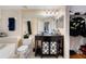 Bathroom features a shower/tub, a vanity with a mirror and a walk in closet at 5578 Metrowest Blvd # 310, Orlando, FL 32811