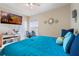 Relaxing bedroom featuring a wall-mounted TV, creating the perfect retreat for unwinding at 5578 Metrowest Blvd # 310, Orlando, FL 32811