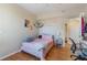 Bedroom featuring hardwood floors and bed at 5578 Metrowest Blvd # 310, Orlando, FL 32811