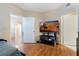 Bedroom featuring hardwood floors and flat screen TV at 5578 Metrowest Blvd # 310, Orlando, FL 32811