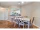 Dining area featuring hardwood floors, neutral paint, and view of the kitchen at 5578 Metrowest Blvd # 310, Orlando, FL 32811