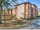 Charming multi-story condo building with a tile roof, offering a comfortable and inviting place to call home at 5578 Metrowest Blvd # 310, Orlando, FL 32811