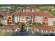 Beautiful apartment complex with a terracotta roof and colorful exterior and well manicured landscaping at 5578 Metrowest Blvd # 310, Orlando, FL 32811