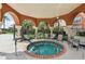 Outdoor hot tub in a covered space surrounded by beautiful landscaping and ample seating at 5578 Metrowest Blvd # 310, Orlando, FL 32811
