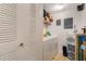 Efficient laundry room with washer, dryer, and storage, simplifying chores and maximizing space at 5578 Metrowest Blvd # 310, Orlando, FL 32811