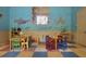 Bright, colorful playroom with ocean themed murals for residents and their guests at 5578 Metrowest Blvd # 310, Orlando, FL 32811
