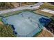 Aerial view of tennis courts with lighting for evening game play at 5578 Metrowest Blvd # 310, Orlando, FL 32811