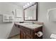 Bright bathroom showcasing a vanity with granite countertop and ample lighting at 6403 Parc Corniche Dr # 4204, Orlando, FL 32821