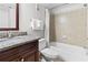 Well-maintained bathroom featuring a vanity with granite countertop and a shower-tub combo at 6403 Parc Corniche Dr # 4204, Orlando, FL 32821