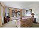 Comfortable living room with cozy furniture, a TV, and a large window with a view at 6403 Parc Corniche Dr # 4204, Orlando, FL 32821