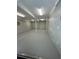 Spacious basement featuring concrete flooring, neutral walls, and industrial lighting at 719 Se 24Th St, Ocala, FL 34471