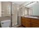 Bathroom featuring tile flooring, a vanity with sink, and glass block windows at 719 Se 24Th St, Ocala, FL 34471