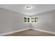 Bedroom with carpet floors and a window at 719 Se 24Th St, Ocala, FL 34471